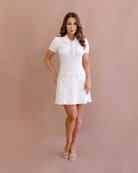 Nadine Knit Mini in white featuring textured knit material with sequin detailing and a button-adorned collar by Jador.